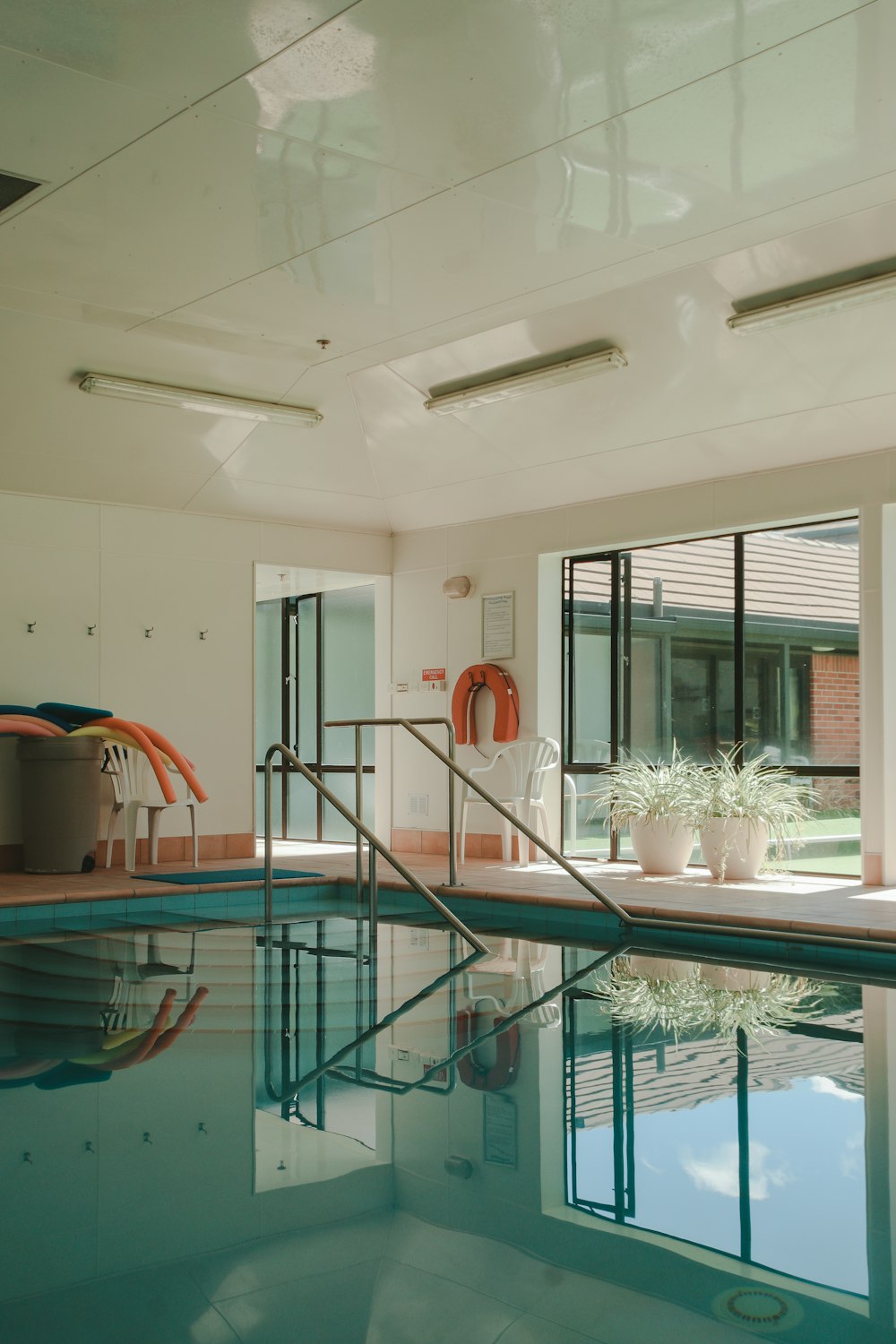 rectangular green indoor swimming pool