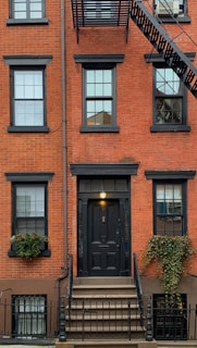 orange concrete building showing closed door
