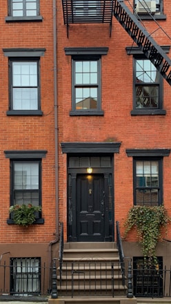 orange concrete building showing closed door
