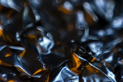 Close-up of shiny metal scraps reflecting light, showing texture and variety.