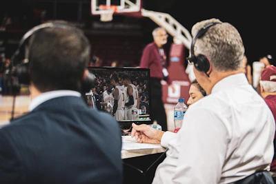 Close-up of the sports director discussing strategy with team members