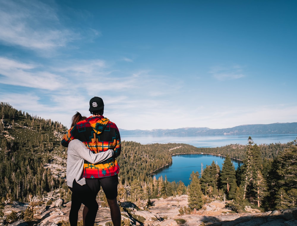 man and woman hugging each other outdoors