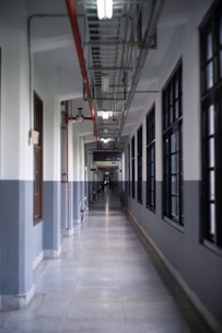 architectural photography of hallway aisle