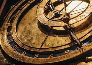 a close up of a clock with roman numerals