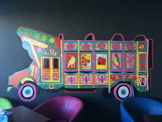 Close-up of a hand-painted mural on a truck’s door featuring bold colors and intricate details