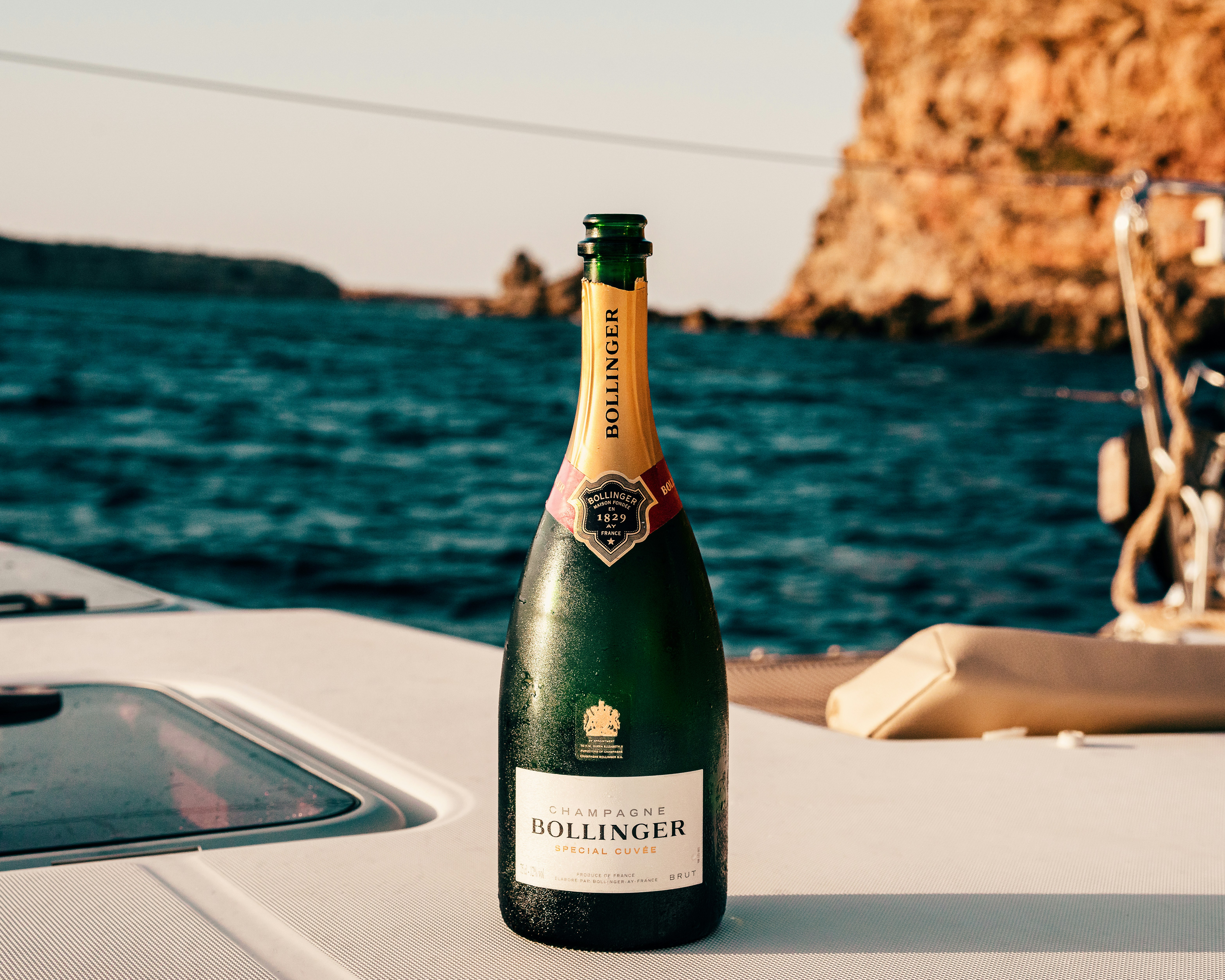 Bollinger wine bottle on white surface