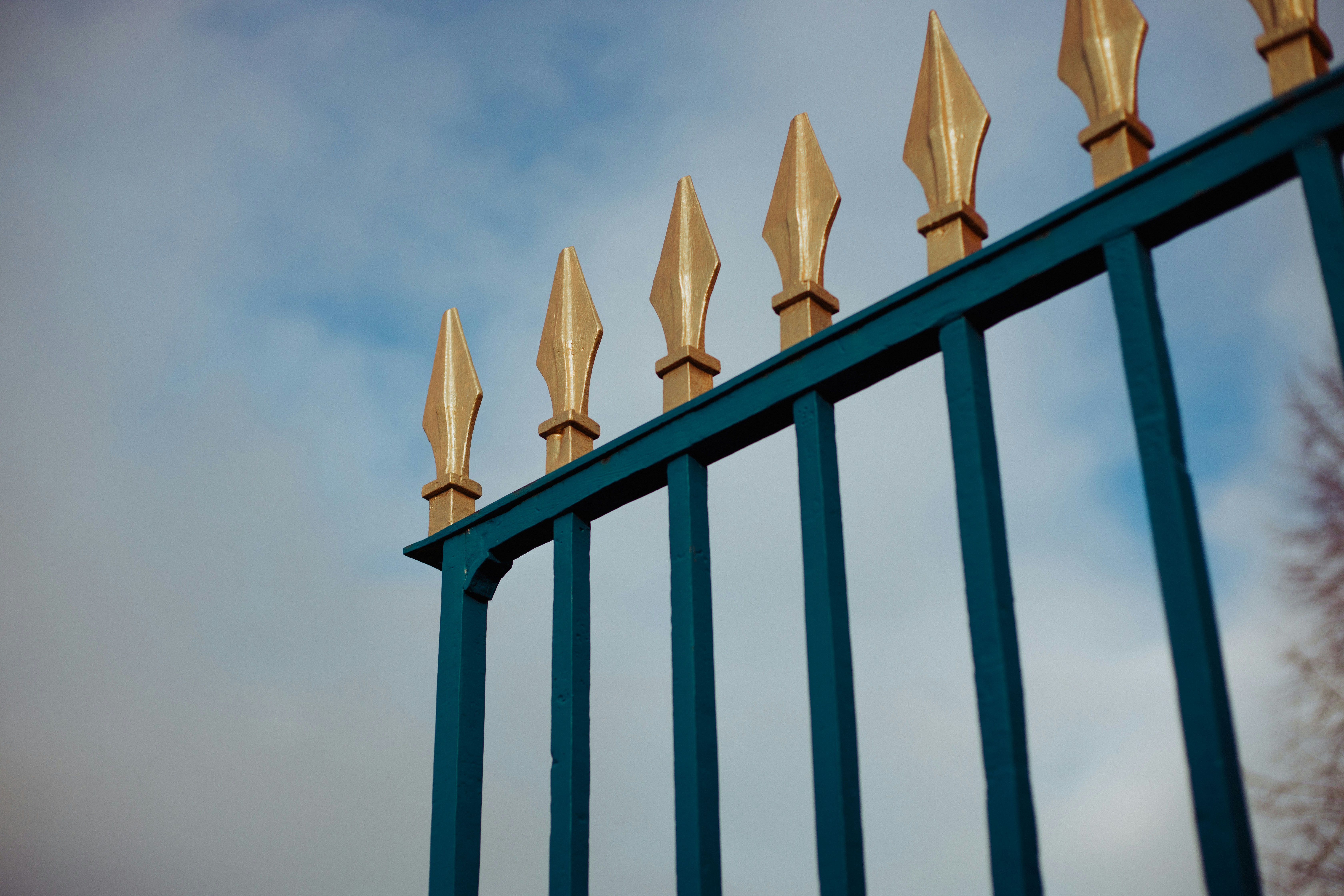 blue and gold metal gate