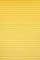 a yellow garage door that is closed