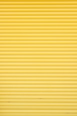 Yellow roller shutter of a warehouse