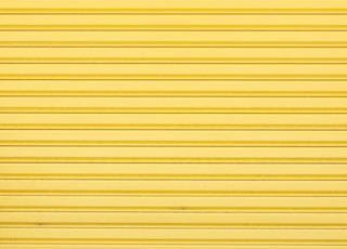 Yellow roller shutter of a warehouse