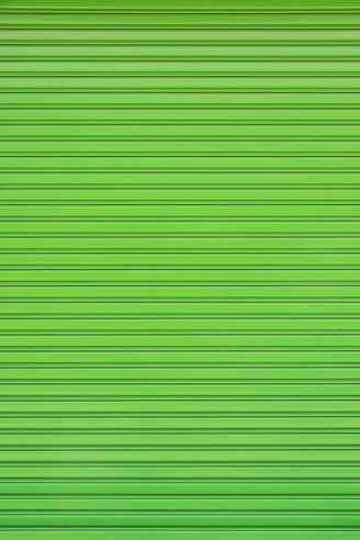 a close up of a green garage door