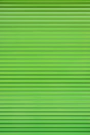 a close up of a green garage door