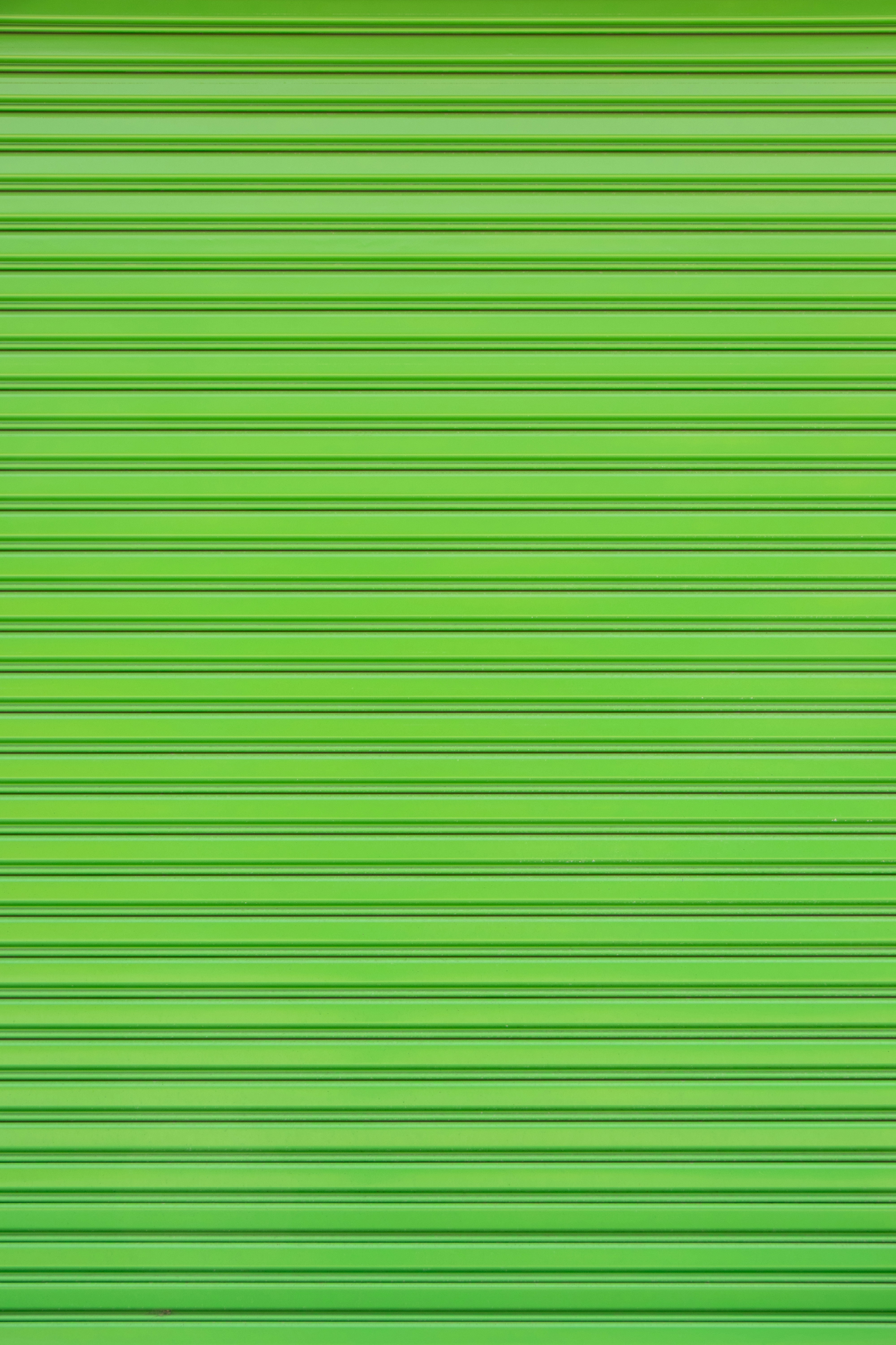a close up of a green garage door