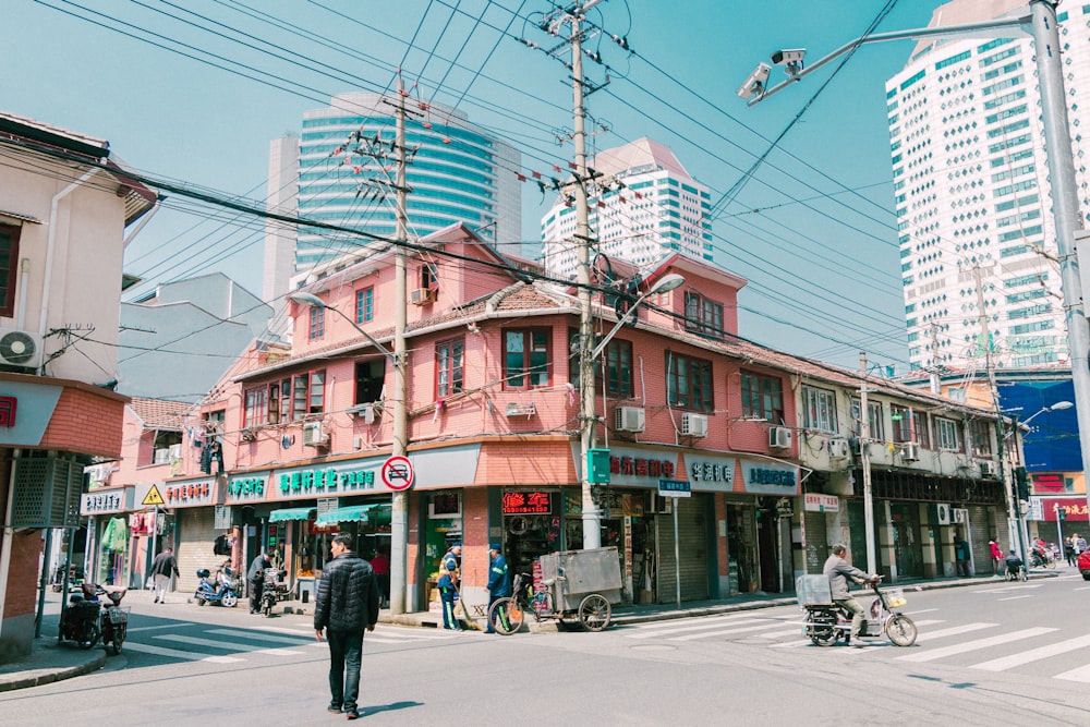 people near buildings during day