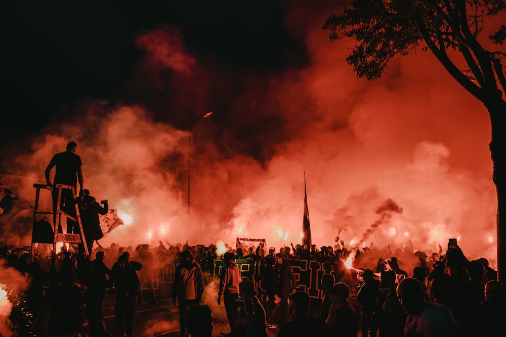 people and smokes during night