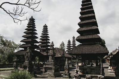a group of stone structures with trees in the background