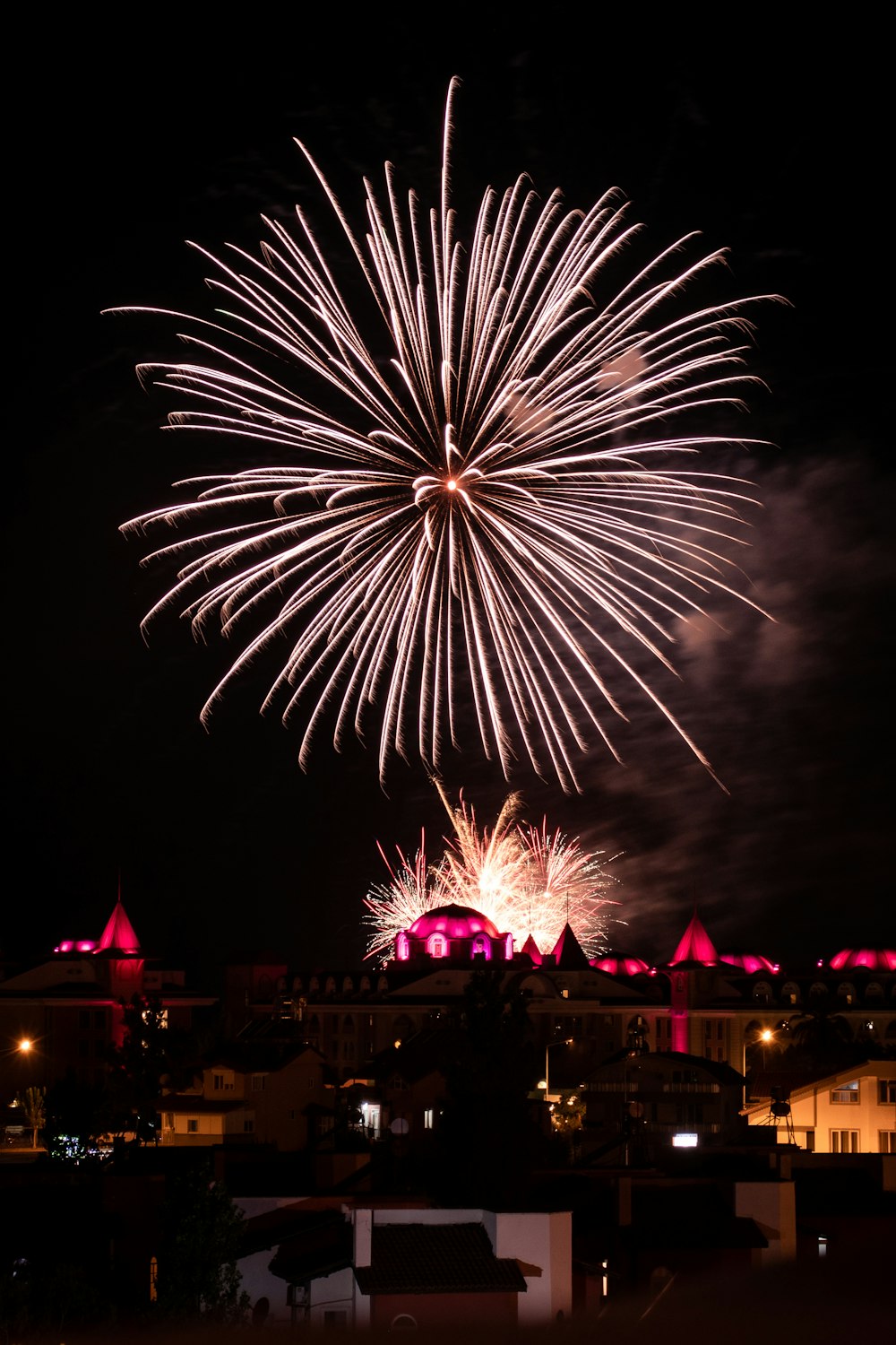 fireworks above buildings during night