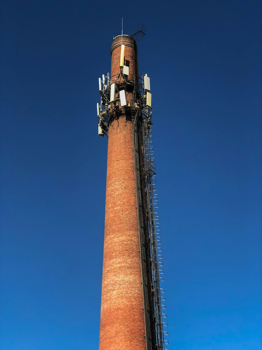 selective focus photography of brown tower under blue sky