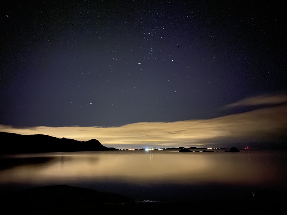 calm body of water during nighttime