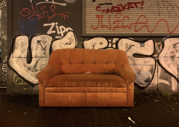 shallow focus photo of brown padded couch