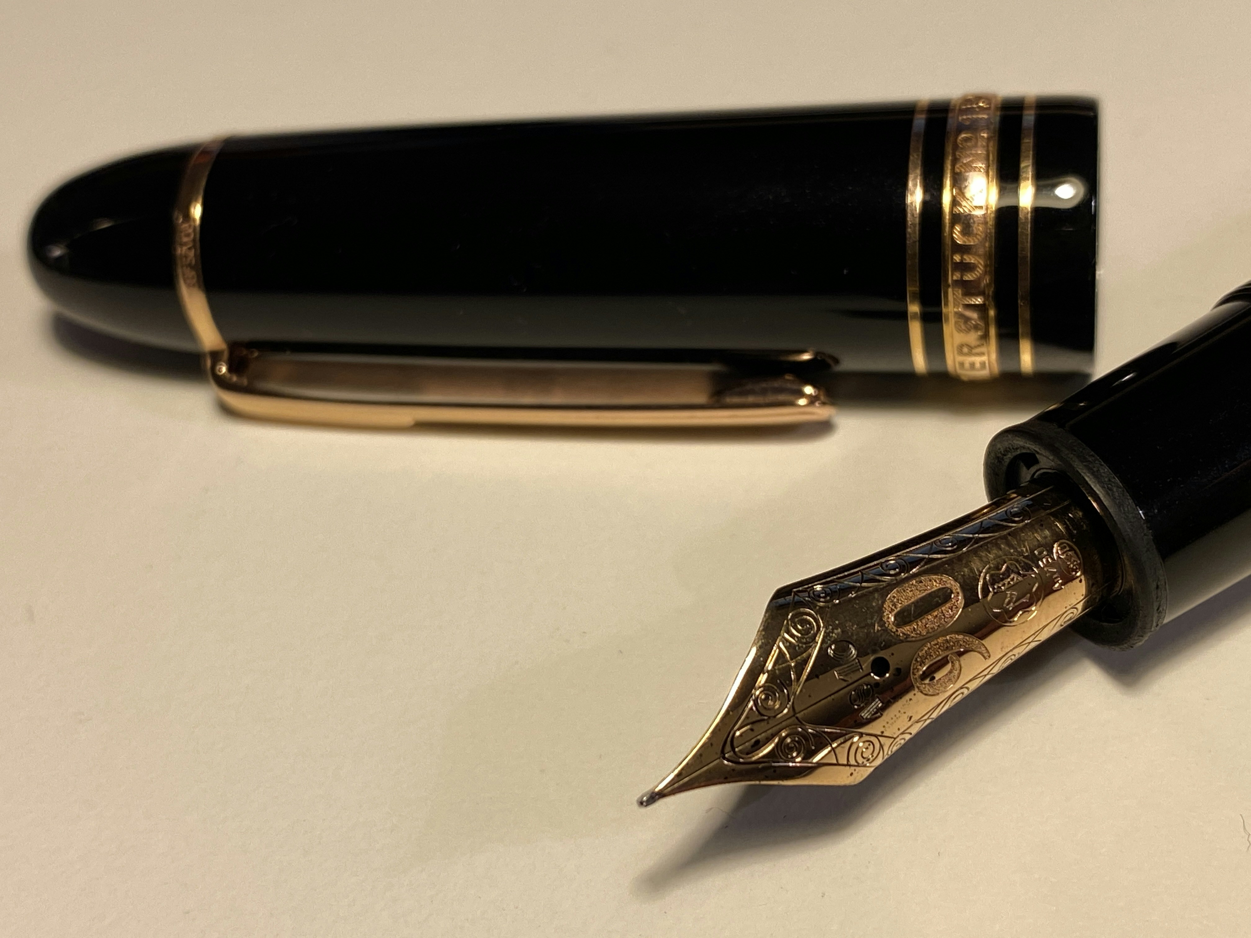 Black luxury fountain pen with gold accents