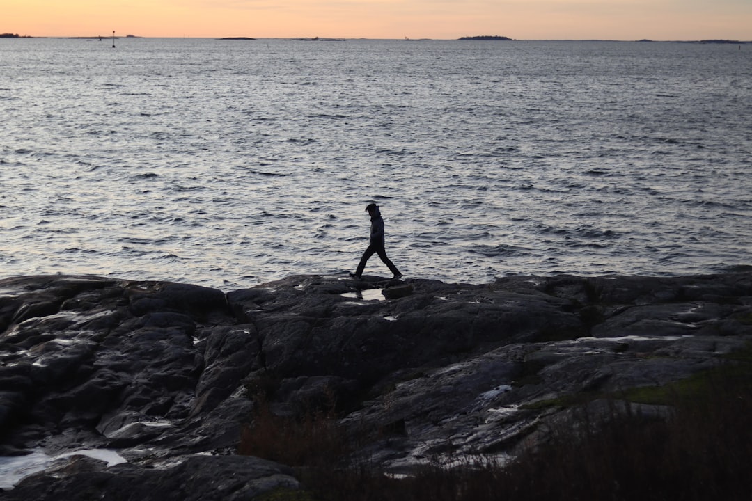 person walking on rocks