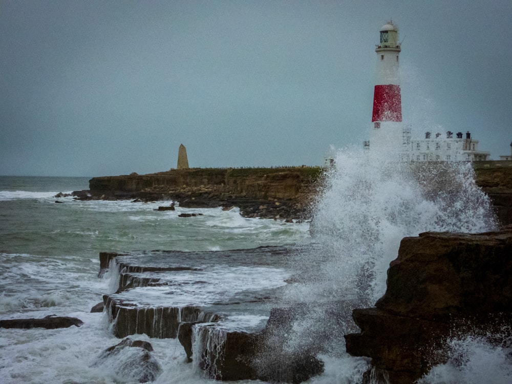 time-lapse photography of waves splashing on seawall