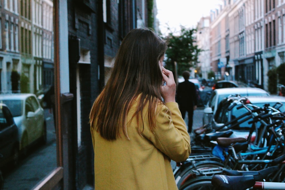 woman wearing yellow cardigan