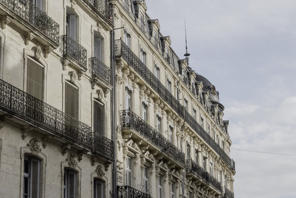 beige building with balconies during day