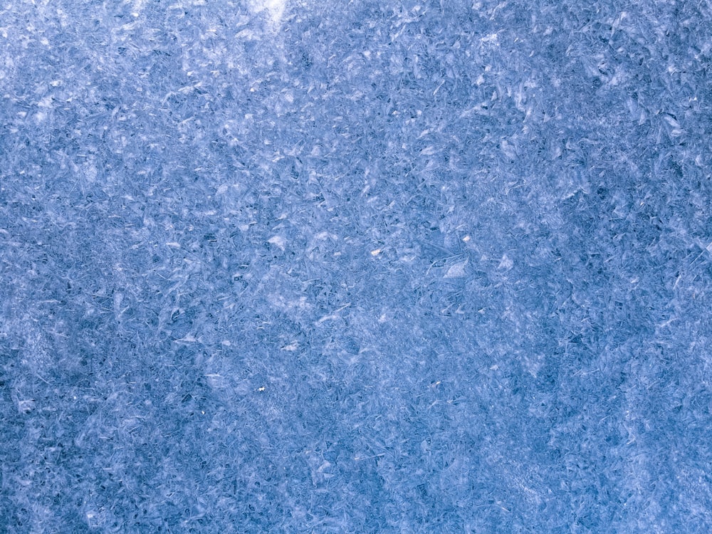 a close up view of a blue marble surface