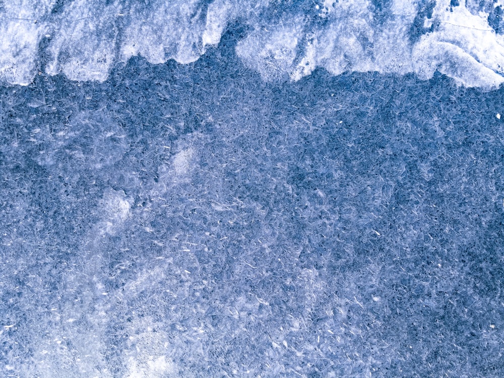 an aerial view of a snow covered mountain