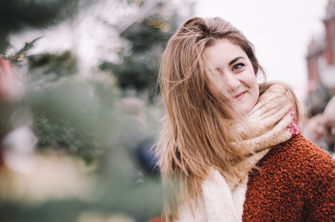 woman wearing brown knitted scarf