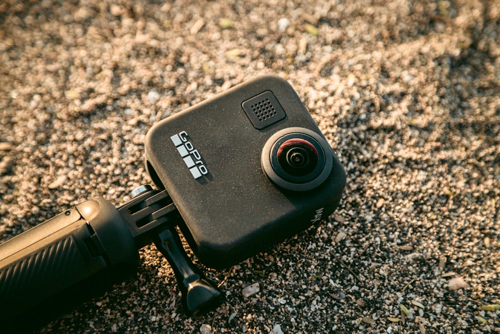 black GoPro action camera in the sand