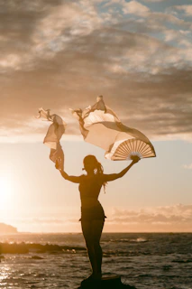 woman waving hand fans
