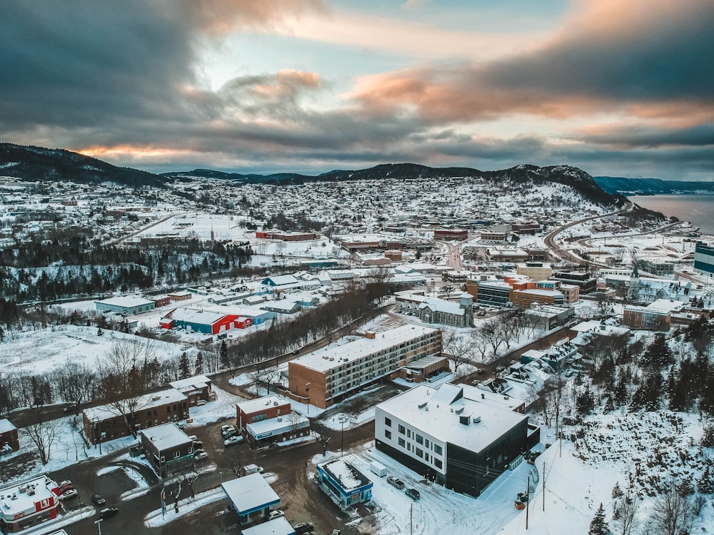 aerial photography of buildings covered with snow