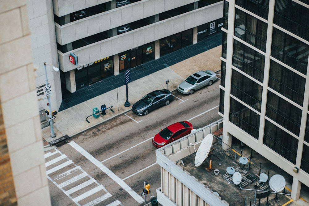 aerial view of vehicles on road beside buildings