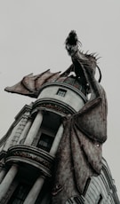 shallow focus photo of dragon on gray building