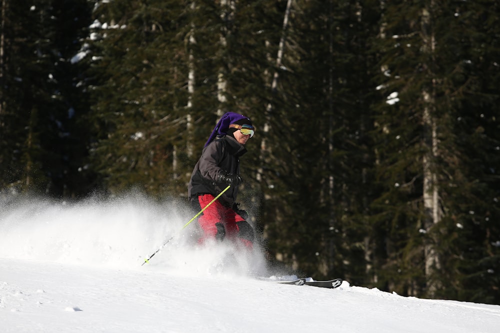 person skiing in the snow during daytime