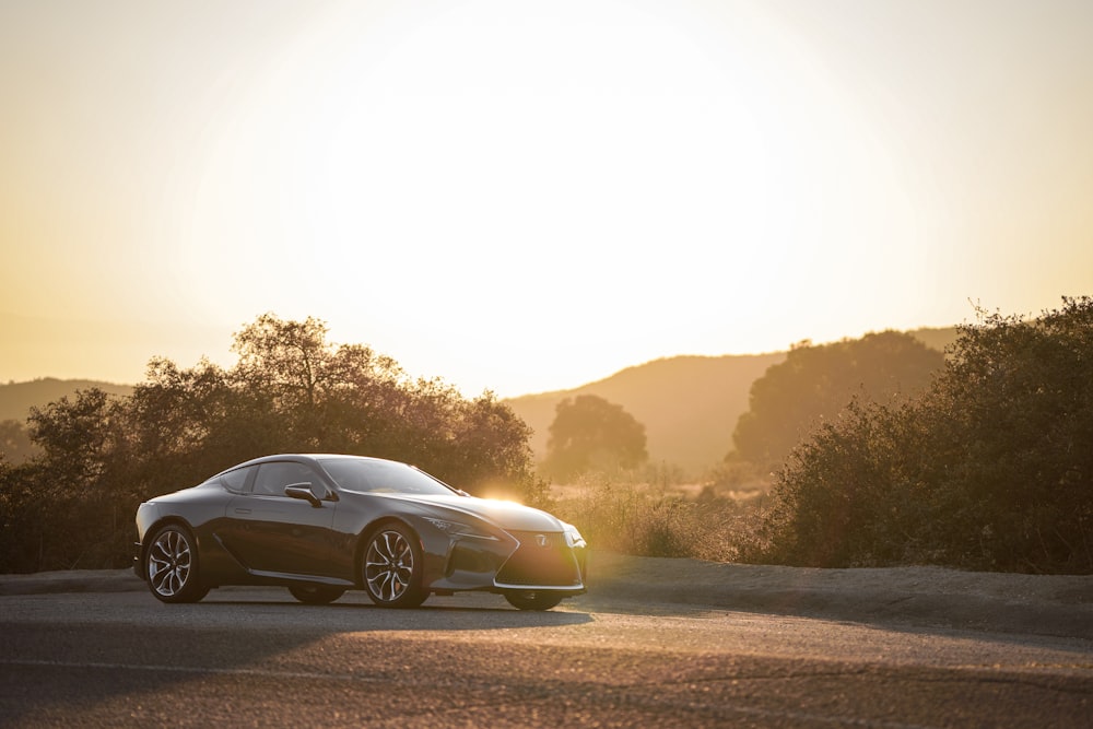 black Lexus coupe in the road during daytime