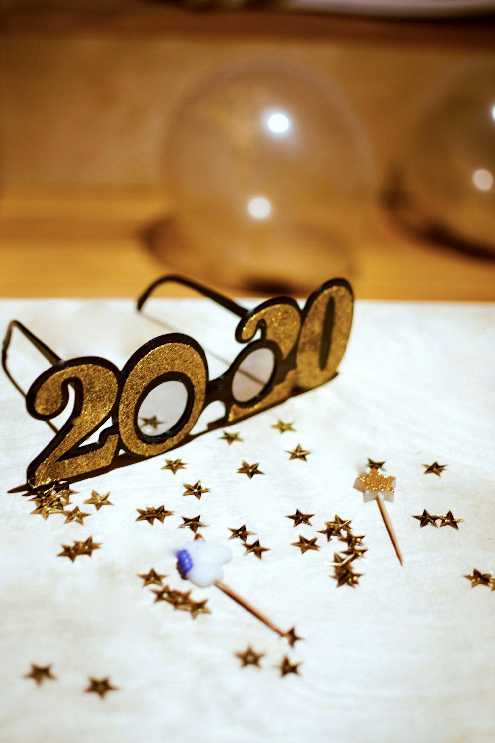 selective focus photography of 2020 eyeglasses on table