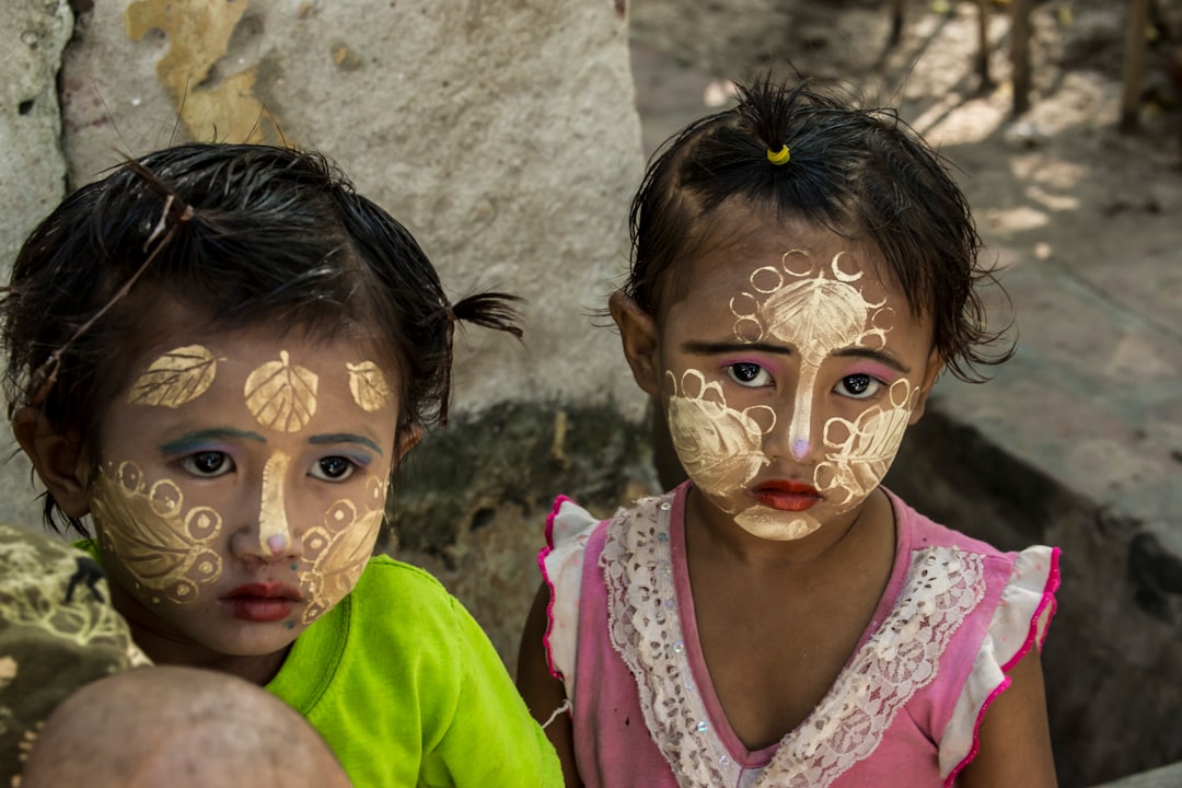 two children with floral face paints