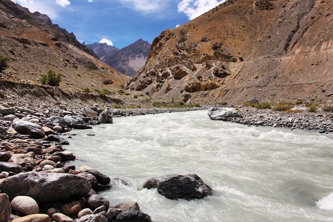 water stream near hills