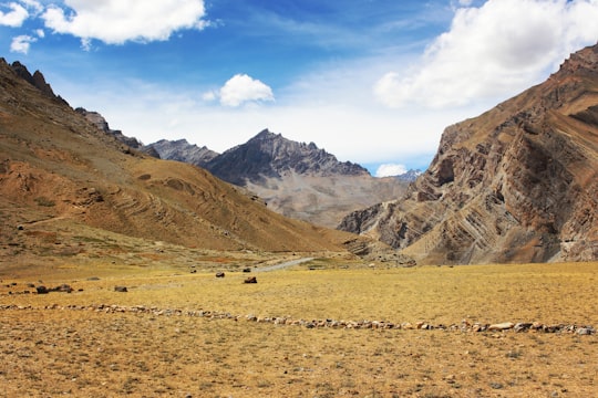 green mountains under blue sky in Ladakh India