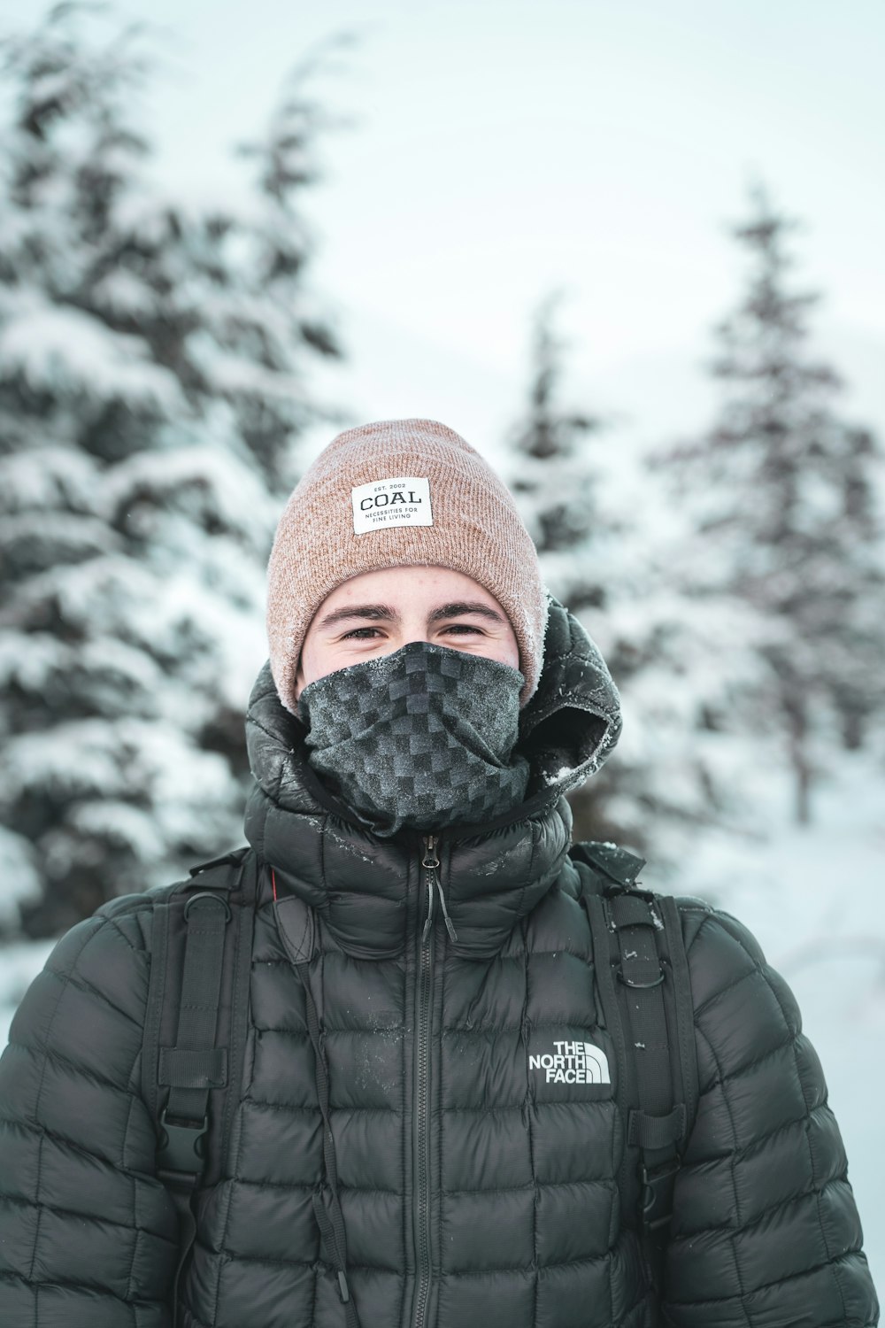 selective focus photography of man wearing bubble coat