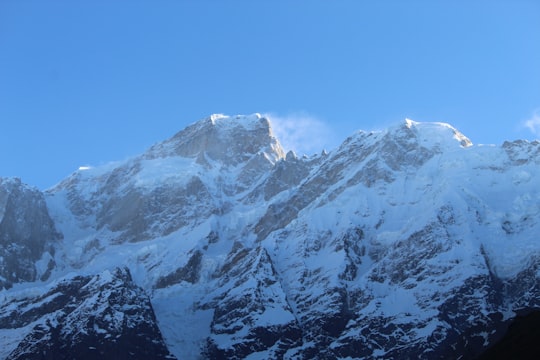 mountain covered with snow in Kedarnath Temple India