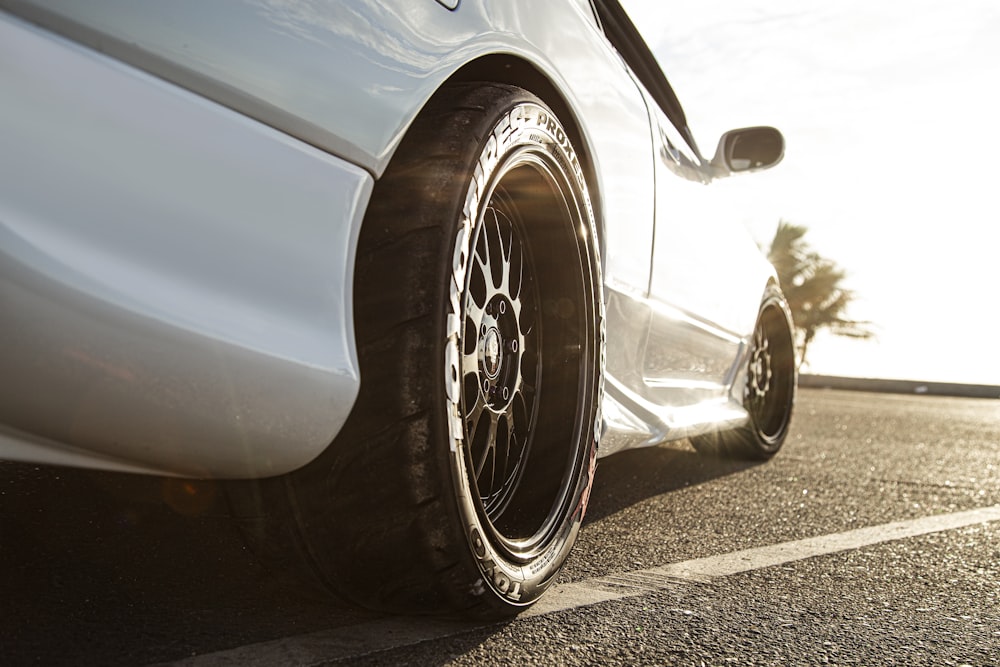 white car parked on road during day