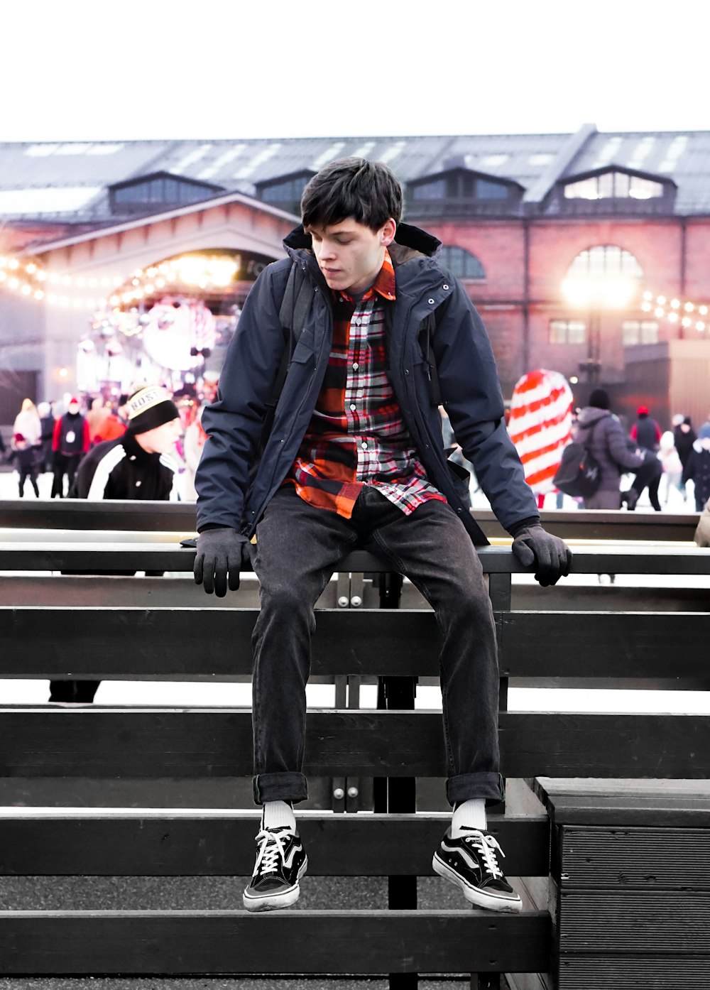 man sitting on a bleacher