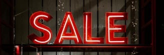 red and white letter sale sign