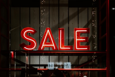 red and white letter sale sign