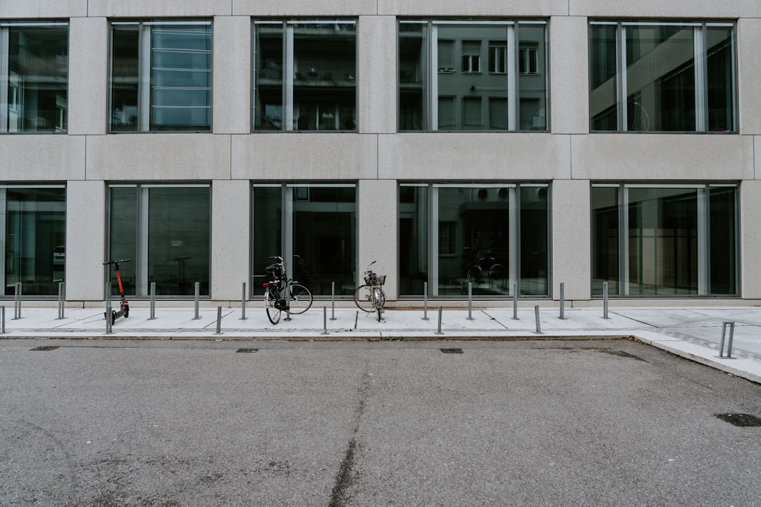 bikes and scooter parked near building